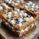 The allure of S'mores is undeniable—a beloved dessert that evokes memories of cozy campfires, laughter among friends, and the sweet, smoky aroma of marshmallows toasting over an open flame. For those who want to capture that nostalgic essence without the hassle of outdoor cooking, S'mores Cookie Bars are the perfect solution. These delightful bars bring together the classic flavors of chocolate, marshmallow, and graham cracker in a convenient, easy-to-make dessert that is ideal for gatherings, family events, or an indulgent treat at home.